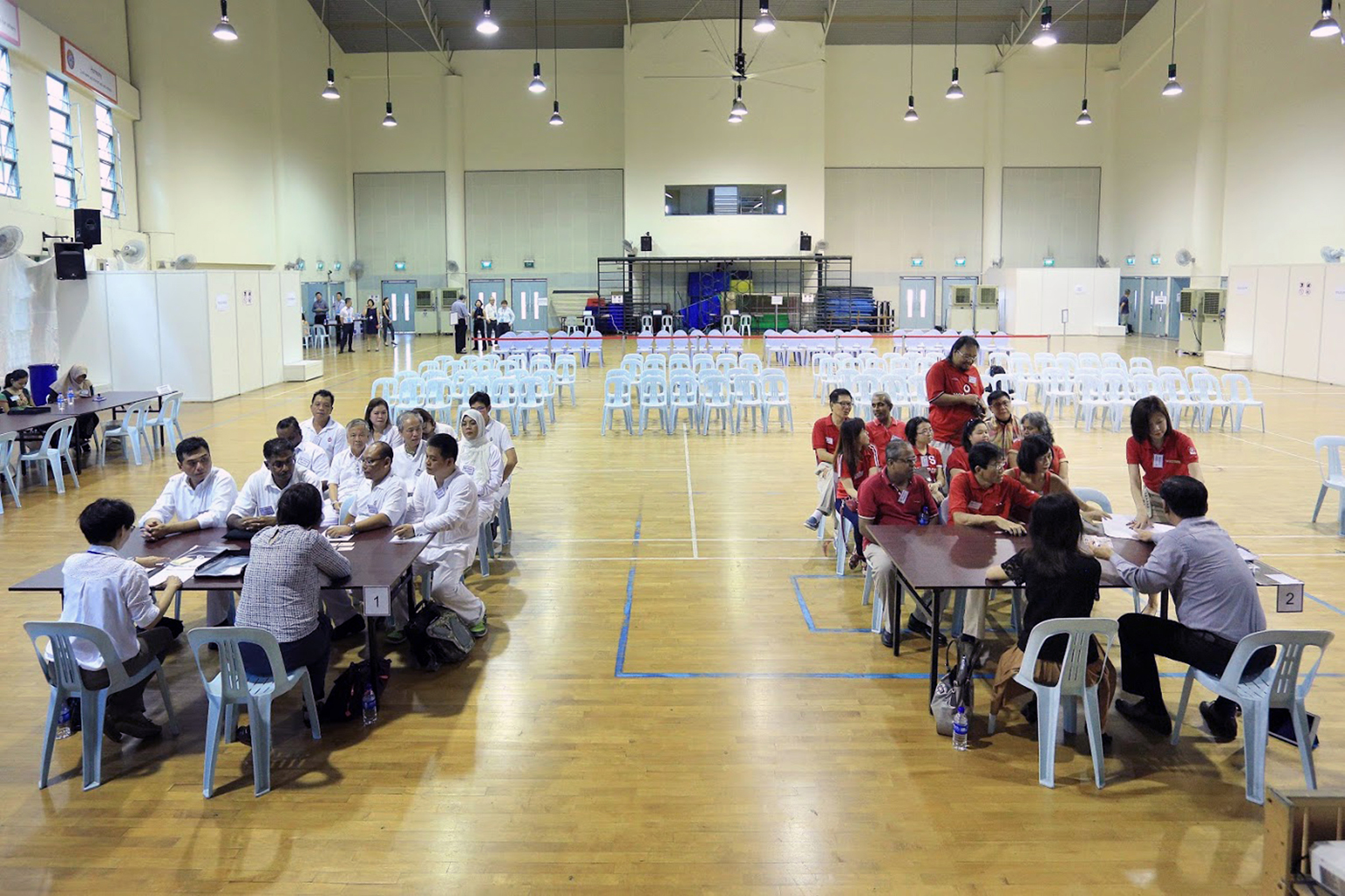 The PAP's Mr Murali Pillai (left) and SDP's Dr Chee Soon Juan (right), accompanied by their party members, submitting their nomination forms last Wednesday at Keming Primary School.