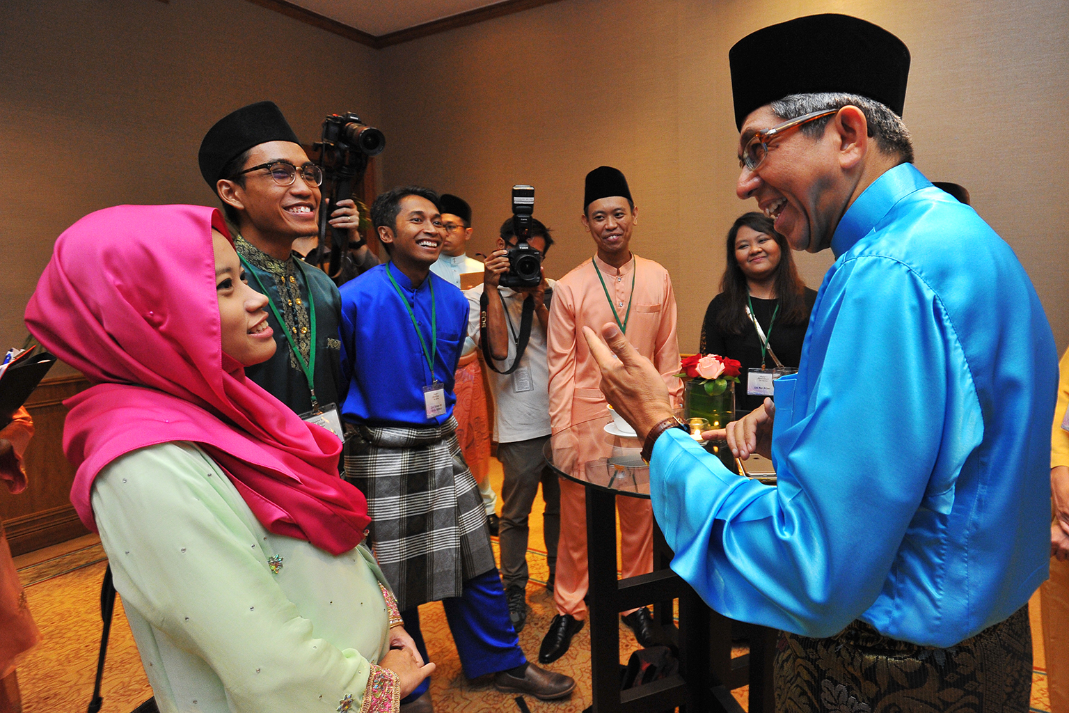 Dr Yaacob with (from left) registered nurse Nur Farahin Mohamed Zakaria, 25; scientist Muhammad Azhari Mohammad Zain, 26; Mr Zool Ikhsan Abdul Rahman, 34, a manager; and Temasek Polytechnic student Nurhakim Supar, 25; at the annual Hari Raya get-toge