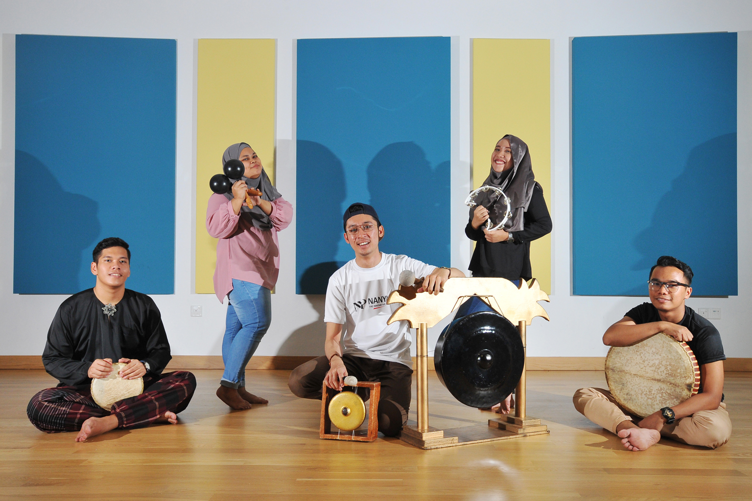 Nanyang Polytechnic's dikir barat team members (from left) Muhammad Aidil Azman, 19, with the tok juara; Masayu Nurulhuda Mohammed Shiddek, 21, with the anak rebana; Yasser Abqari Abdul Nassir Basalamah, 24, on the gong and chanang; Siti Munirah Aman