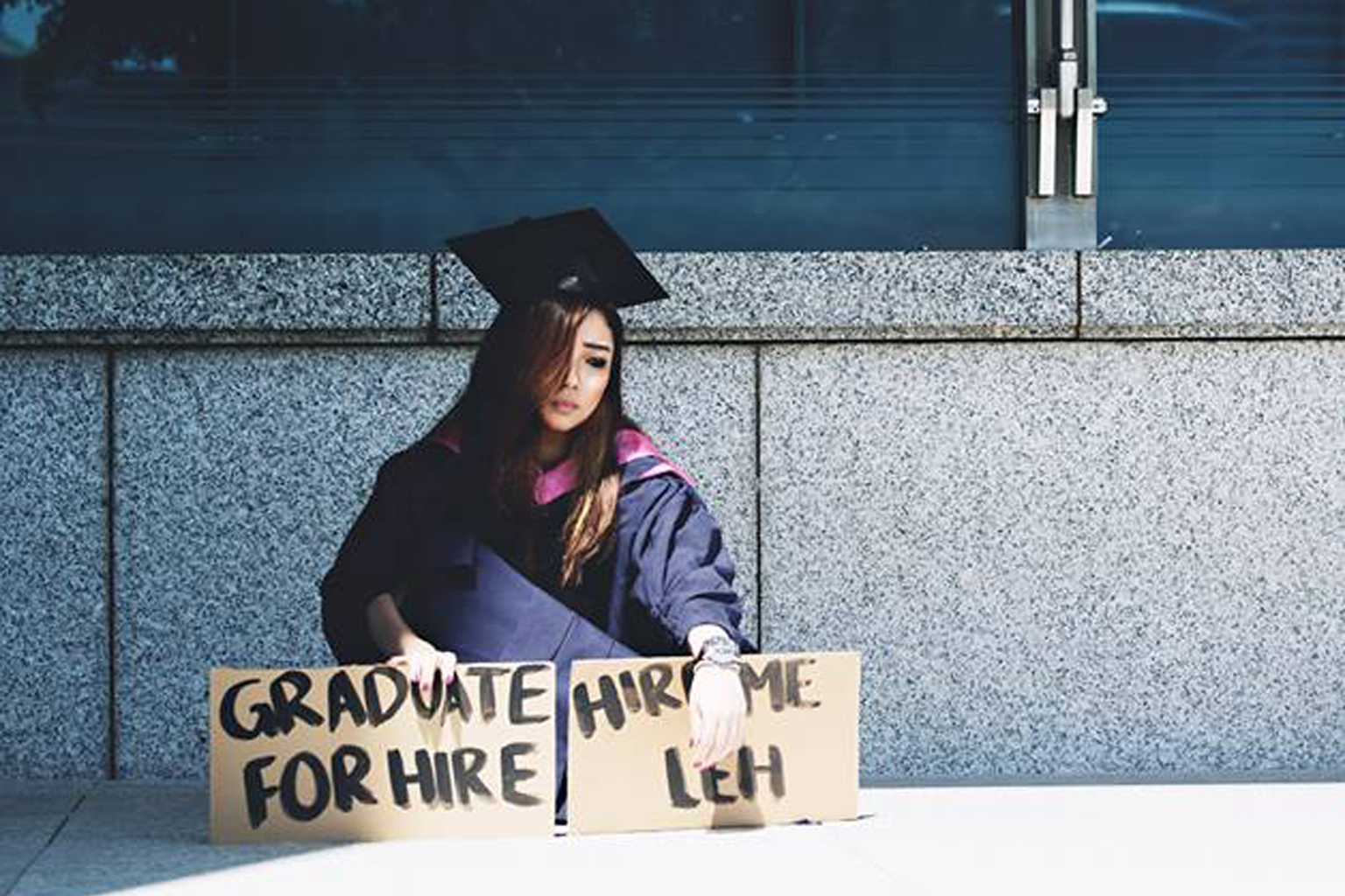 Ms Boon posing for a bleak graduation shot that struck a chord with many fellow graduates facing a tough job market.