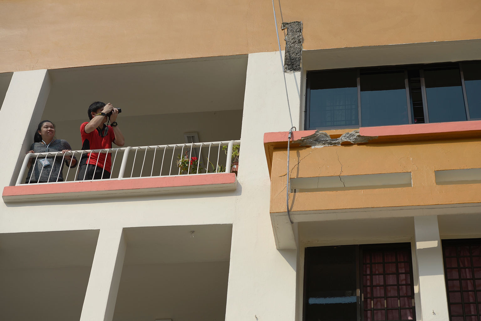 Cables supporting the sunshade on the third floor of Block 201E, Tampines Street 23 as a safety measure after the one above landed on it.