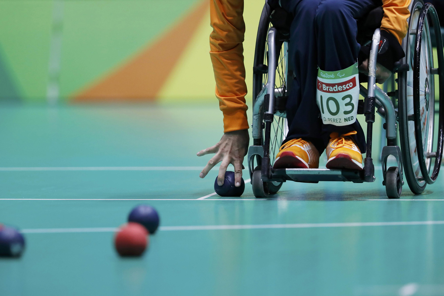 In boccia (above), players throw or roll balls as close as possible to a target ball. Boccia is one of the more popular disability sports in Singapore.