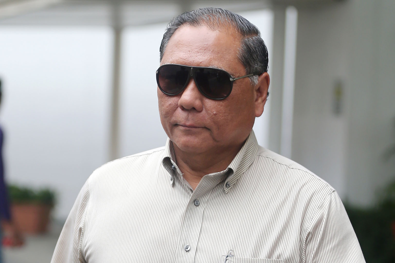 Lee fed endangered grey-headed fish eagles with live fish injected with air to get a perfect photo.