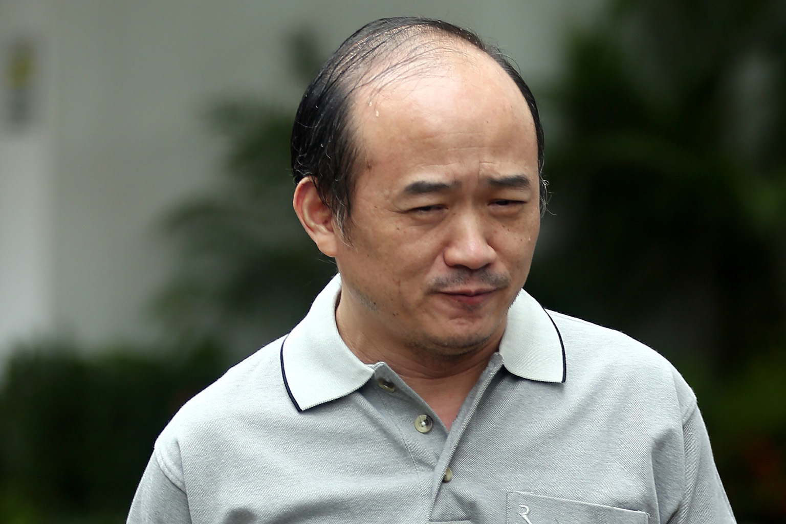 Mick Davies entered Singapore using a passport with the name Fu Ching that he had bought in Vietnam.