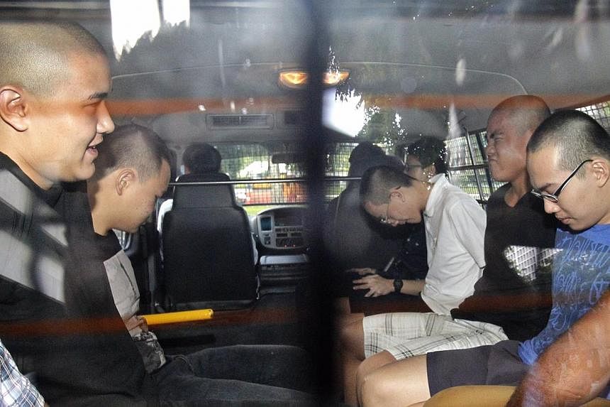 (From left) David William Graaskov, Goh Rong&nbsp;Liang, Chay Nam Shen, Boaz Koh Wen Jie, and&nbsp;Reagan Tan Chang Zhi – all Singaporeans, aged&nbsp;17 and sporting shaved heads – are being&nbsp;remanded as investigations continue.&nbsp;-- ST PH