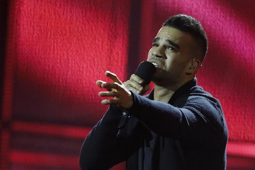 Singer Andras Kallay-Saunders representing Hungary performs the song Running during the grand final of the 59th Eurovision Song Contest at the B&amp;W Hallerne in Copenhagen on May 10, 2014. -- PHOTO: REUTERS