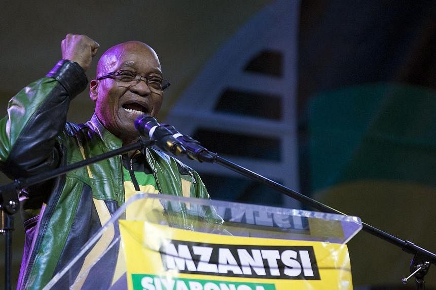 South African President Jacob Zuma celebrates the African National Congress victory in the national election in Johannesburg on May 10, 2014. -- PHOTO: AFP