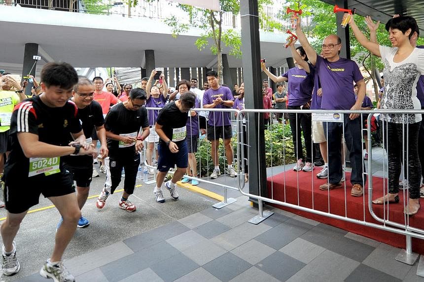 More than 1,000 participants took part in the first vertical mass run held at the iconic 50-storey Housing Board (HDB) flats at the Pinnacle@Duxton on Sunday. -- PHOTO: MATTHIAS HO FOR THE STRAITS TIMES