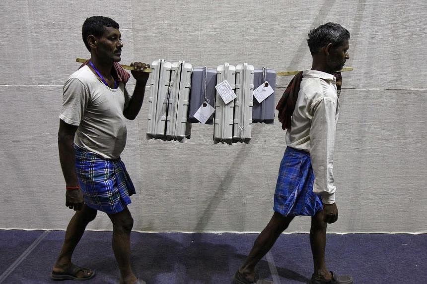 Electronic voting machines being carried to an election material distribution centre on the eve of the final phase of general election in Kolkata on May 11, 2014. -- FILE PHOTO: REUTERS