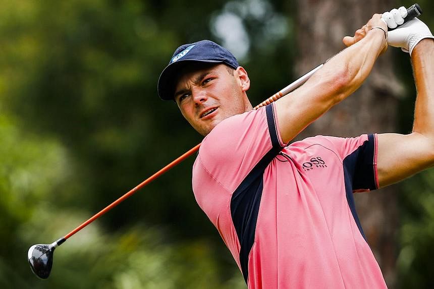 Martin Kaymer of Germany hits his tee shot on the second hole during the fourth round of The Players Championship on the Stadium Course at TPC Sawgrass in Ponte Vedra Beach, Florida, USA on May 11, 2014. Kaymer survived a late double-bogey to win the