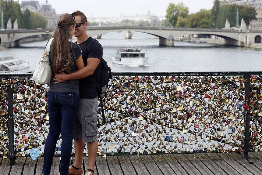 A massive number of padlocks hitched by lovers on the Pont des Arts. -- FILE PHOTO: AFP