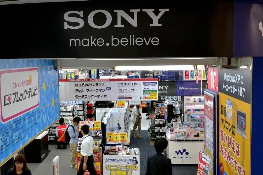 A logo of Japanese electronics giant Sony is displayed at a shop in Tokyo on May 13, 2014.&nbsp;Struggling electronics giant Sony will not pay bonuses to senior executives for the third straight year, the Japanese company said Tuesday, as it braces f