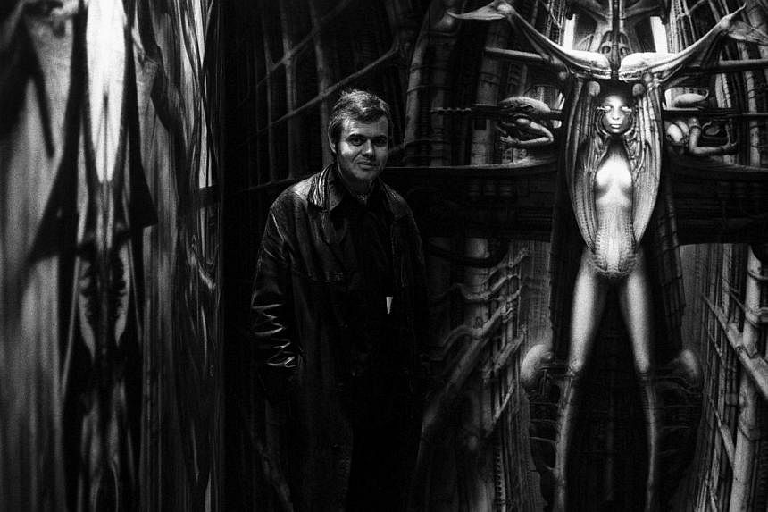 &nbsp;Swiss artist H. R. Giger standing with some of his artworks in Switzerland on Oct 29, 1981.&nbsp;&nbsp;-- FILE PHOTO: EPA