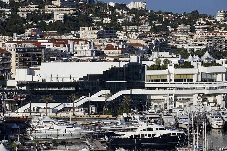 A general view shows the Festival Palace and the Port of Cannes on the eve of the opening of the 67th Cannes Film Festival in Cannes on May 13, 2014. -- PHOTO: REUTERS