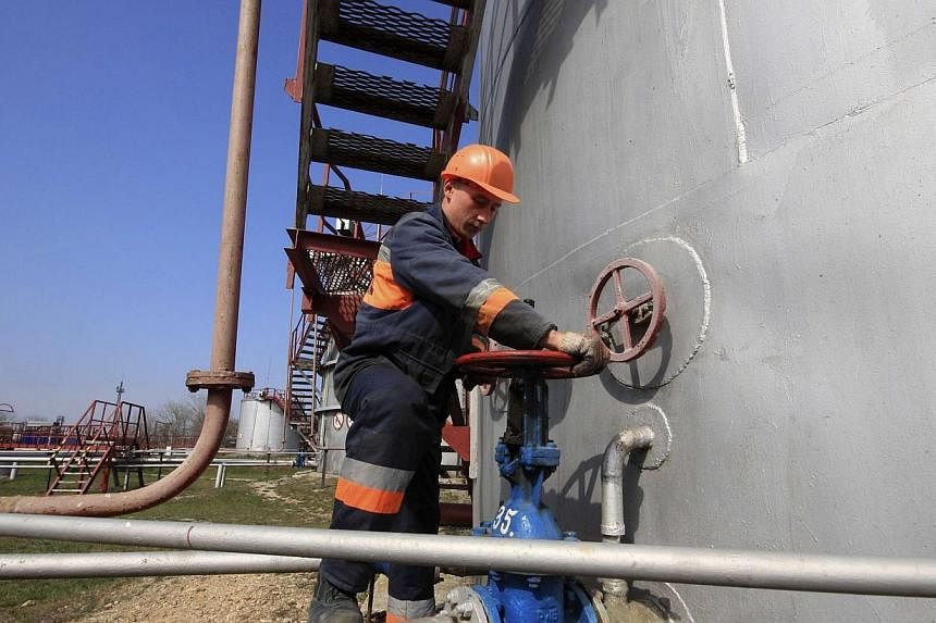 A worker checks the valve of a gas pipe at an underground gas storage facility of the Chernomorneftegaz company in the village of Glebovka, in Crimea's Chernomorsky district, April 9, 2014.&nbsp;Russia is ready to discuss price and conditions for gas