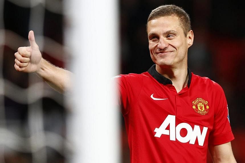Departing Manchester United captain Nemanja Vidic (above) has denied the players failed to give their all for former manager David Moyes. -- FILE PHOTO: REUTERS