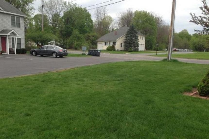 The bounce house was located on this patch of grass, before lifting off the ground and injuring three children, two seriously. -- PHOTO: POSTSTAR.COM/DON LEHMAN