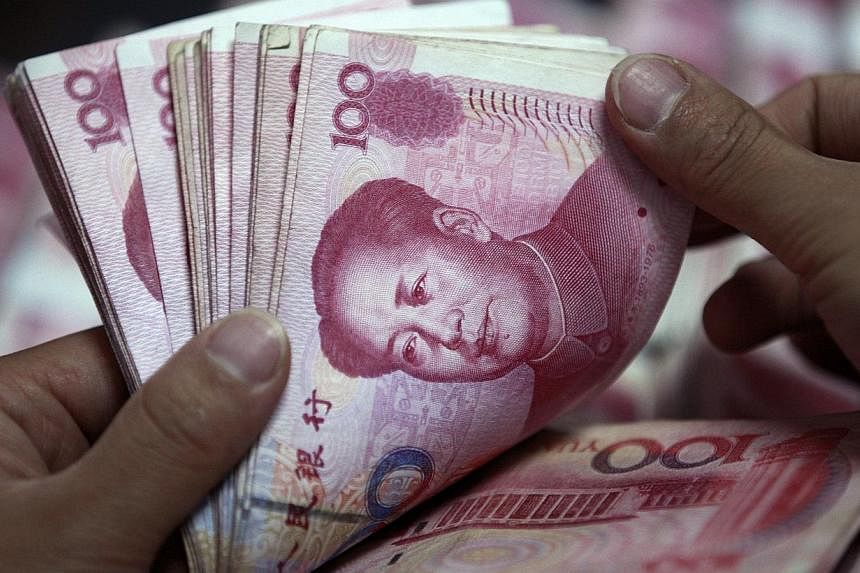 China's yuan briefly hit a one-week high on Wednesday as some investors used recent weakness in the currency to add positions, though the broader market remained unconvinced the yuan's rise is sustainable. -- FILE PHOTO: REUTERS
