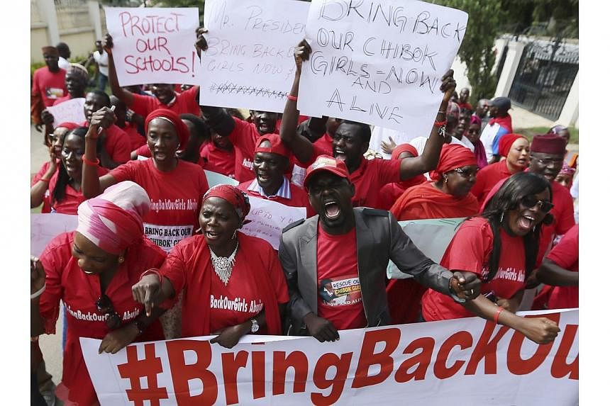 Nigerians take part in a protest demanding for the release of secondary school girls abducted from the remote village of Chibok, in Asokoro, Abuja on May 13, 2014. -- PHOTO: REUTERS