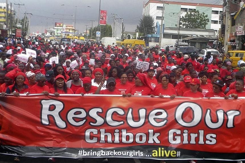 Nigerian members of the women's wing of All Progessive Party (APC) protest over the government's failure to rescue the abducted Chibok school girls in Lagos, Nigeria, on May 13, 2014. More than 200 schoolgirls on Wednesday began their second month as