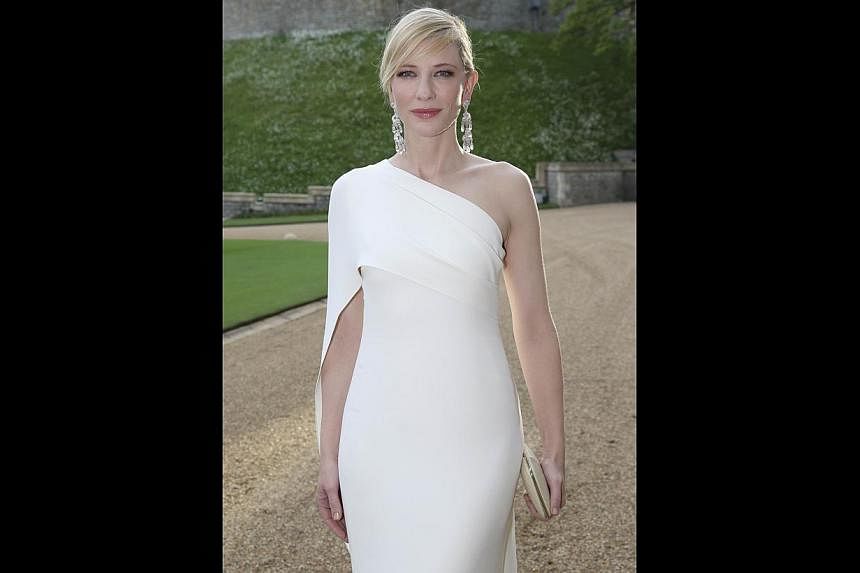 Australian actress Cate Blanchett poses for photographs as she arrives for a dinner to celebrate the work of The Royal Marsden hosted by Prince William, the Duke of Cambridge at Windsor Castle in Windsor, on May 13, 2014. -- PHOTO: AFP