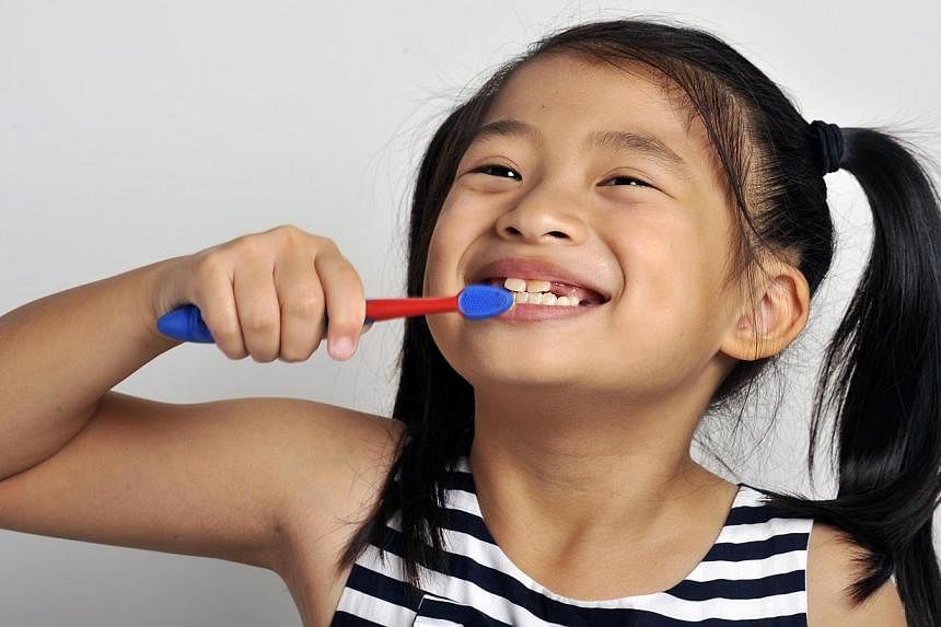 More than half of all children in Singapore have one or more rotten teeth by the time they start primary school. -- ST FILE PHOTO: EDWARD TEO