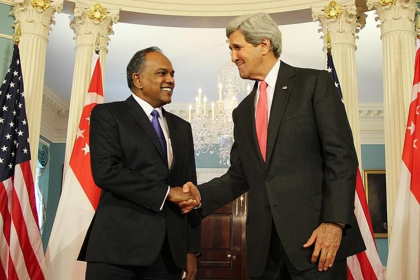 Foreign Minister K. Shanmugam (left) and US Secretary of State John Kerry meeting at the State Department in Washington on May 12, 2014. -- PHOTO: MFA