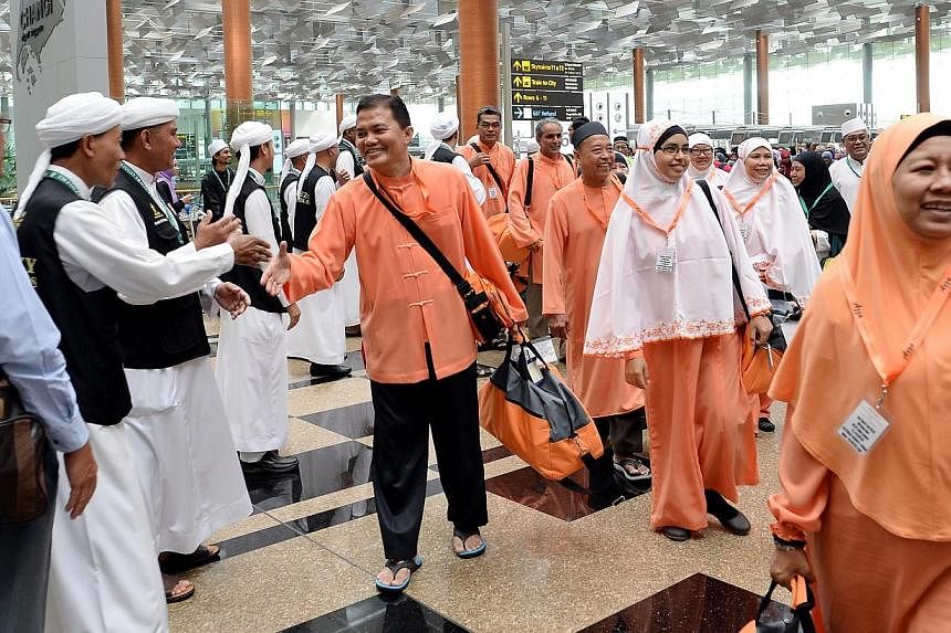 The last batch of Singapore pilgrims at Changi Airport Terminal 3 on 9 October 2013.&nbsp;Singaporean Muslims planning to perform the umrah or minor pilgrimage in May or June should take extra precautions to protect themselves against the recent rise