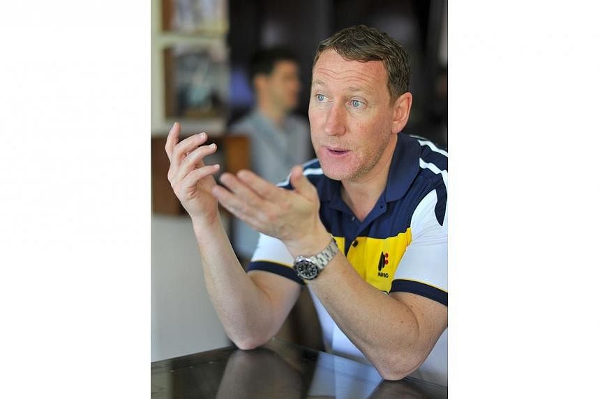 Arsenal legend Ray Parlour believes England should play for a draw in their opening World Cup group match against Italy on June 14. -- ST PHOTO: LIM YAOHUI FOR THE STRAITS TIMES