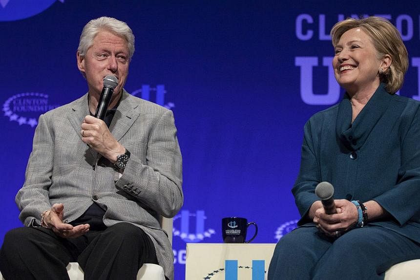 Former President Bill Clinton (left) and former Secretary of State Hillary Clinton discuss how they first were involved in politics during the second day of the 2014 Meeting of the Clinton Global Initiative at Arizona State University in Tempe on Mar