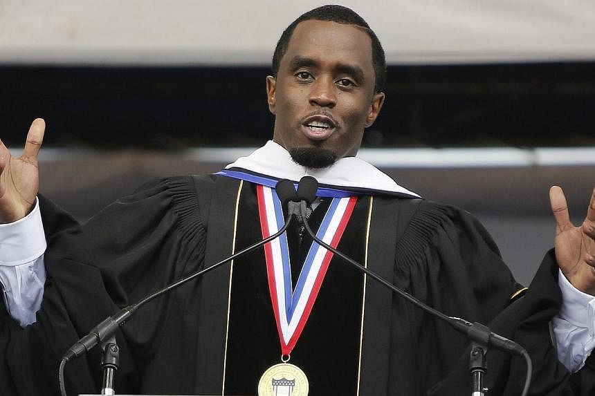 Entertainer Sean Combs delivers the commencement address during the 2014 graduation ceremonies at Howard University in Washington on May 10, 2014. -- FILE PHOTO: REUTERS