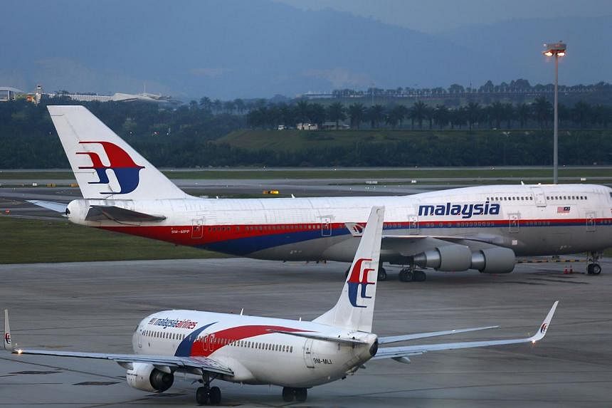 Malaysia Airlines will report first-quarter earnings later on Thursday that are set to provide confirmation of just how badly the already loss-making carrier's finances have been hit by the vanishing of flight MH370 on March 8. -- PHOTO: REUTERS