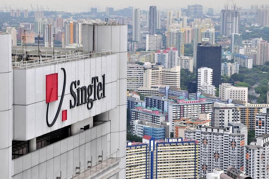 Singapore Telecommunications' fourth-quarter net profit climbed 4 per cent from a year earlier but came in shy of analysts' expectations, hurt by unfavourable exchange rates and a lacklustre performance from its group enterprise business. -- FILE PHO