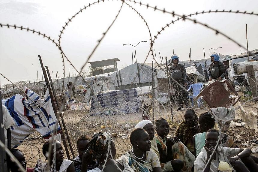 South Sudanese women waiting in line for food distribution inside the UNMISS compound in Juba on February 24, 2014.&nbsp;At least one person has died in war-torn South Sudan of highly contagious cholera with several others infected, sparking concern 