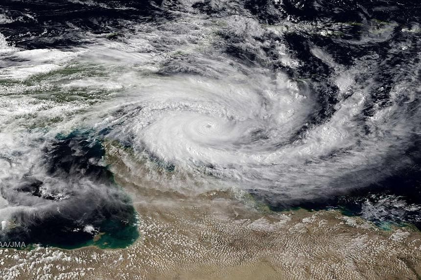 Category 5 Tropical Cyclone Ita is seen approaching the far north Queensland coast of Australia, in this NOAA satellite file image taken at 0130EST/0530GMT on April 10, 2014. -- FILE PHOTO: REUTERS
