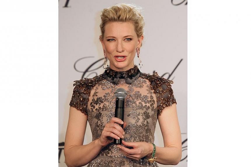 Australian actress Cate Blanchett is gorgeous as always in a dainty gray metallic Valentino. But it is the quirky Chopard earrings that add an unexpected touch of fun - they are in the shape of prawns.&nbsp;-- PHOTO: AFP