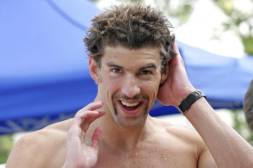 Michael Phelps will take another small step in his comeback to competitive swimming when he competes in two races on Friday but this time he will do it without the presence of his friend and greatest rival. -- ST FILE PHOTO: ADELINE ONG