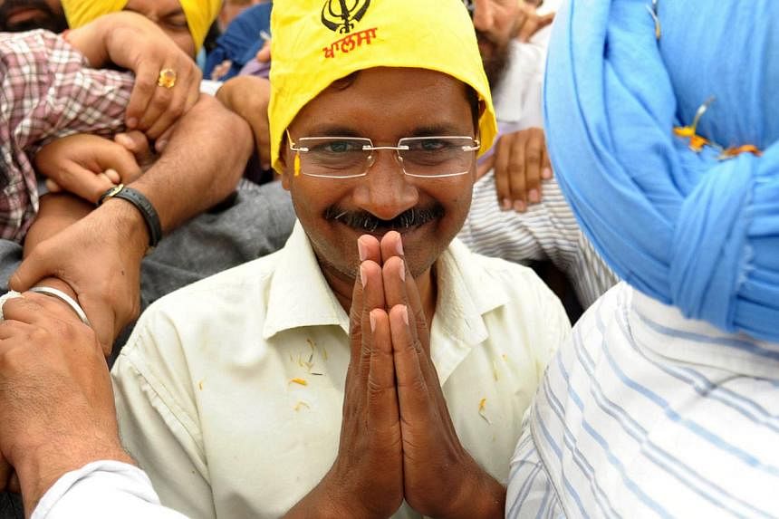 The leader of the Aam Admi Party, Mr Arvind Kejriwal, gestures as he poses for a photograph during a visit to the Golden Temple in Amritsar on April 11, 2014. &nbsp;-- PHOTO: AFP