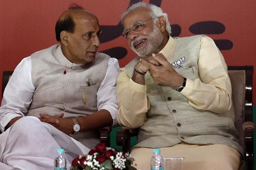 Bharatiya Janata Party prime ministerial candidate Narendra Modi (R) seen with with his party's president Rajnath Singh in New Delhi April 7, 2014. -- PHOTO: REUTERS