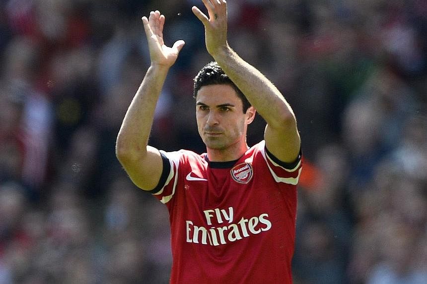Arsenal's Mikel Arteta applauds the fans as he is substituted during their English Premier League soccer match against West Bromwich Albion at the Emirates stadium in London on May 4, 2014.&nbsp;Arsenal midfielder Mikel Arteta has admitted that he wa