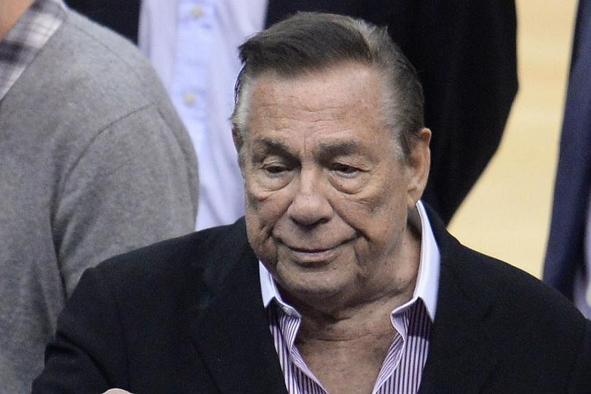 This April 21, 2014 file photo shows Los Angeles Clippers owner Donald Sterling attending the NBA playoff game between the Clippers and the Golden State Warriors at Staples Center in Los Angeles, California.&nbsp;Sterling, who was banned for life fro