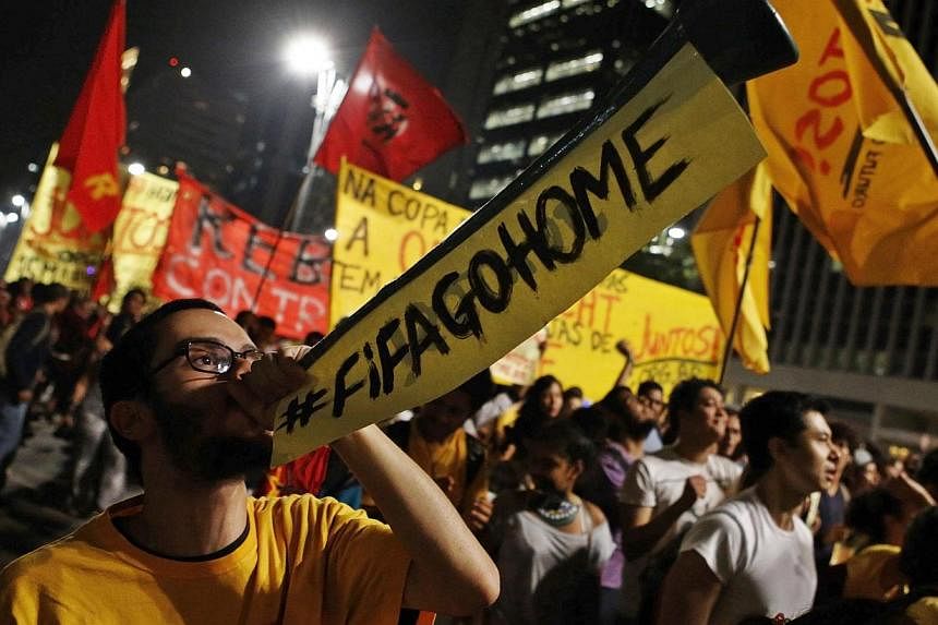 A demonstrator blows a horn during a protest against the 2014 World Cup, in Sao Paulo on May 15, 2014.&nbsp;Brazil faced a test of its security preparations for the World Cup on Thursday as demonstrators aghast at the cost of the event joined protest