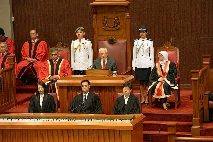 President Tony Tan (centre) flanked by the Speaker of Parliament, Halimah Yacob (right) and Chief Justice Sundaresh Menon (left), gives his address at the opening of the second session of the Twelfth Parliament at the Parliament House, on May 16, 201