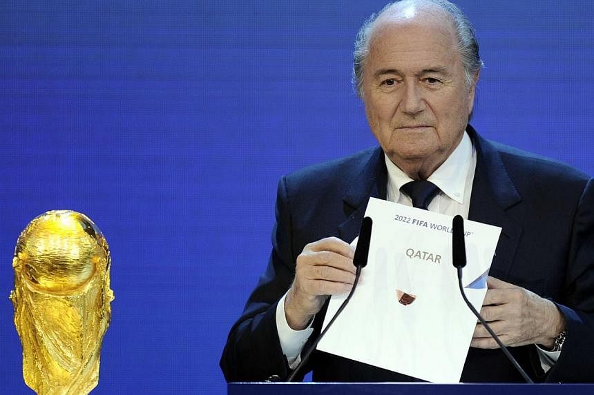 &nbsp;A file picture taken on Dec 2, 2010 shows FIFA President Sepp Blatter holding up the name of Qatar during the official announcement of the 2022 World Cup host country at the FIFA headquarters in Zurich. FIFA president Sepp Blatter on May 15, 20