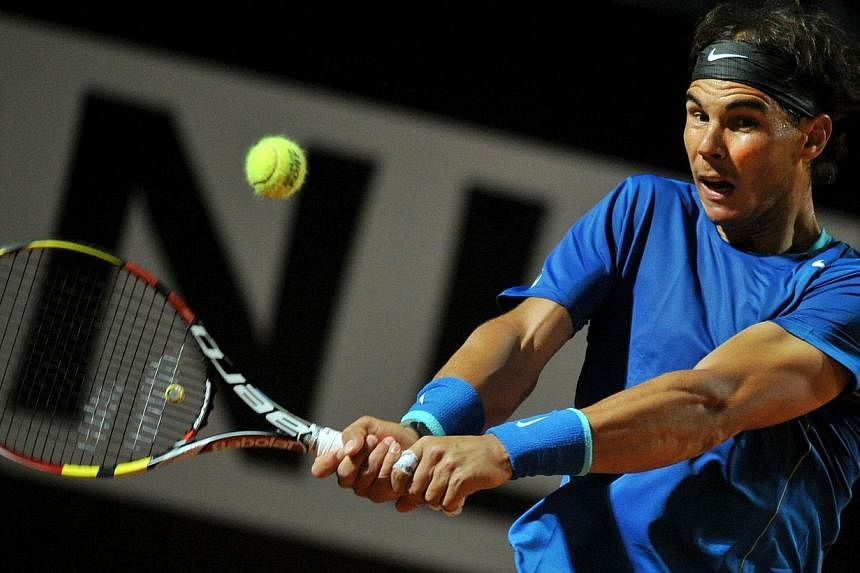 Spain's Rafael Nadal returns the ball to Britain's Andy Murray during the Rome Masters Tennis match on May 16, 2014, at the Foro Italico in Rome. -- PHOTO: AFP