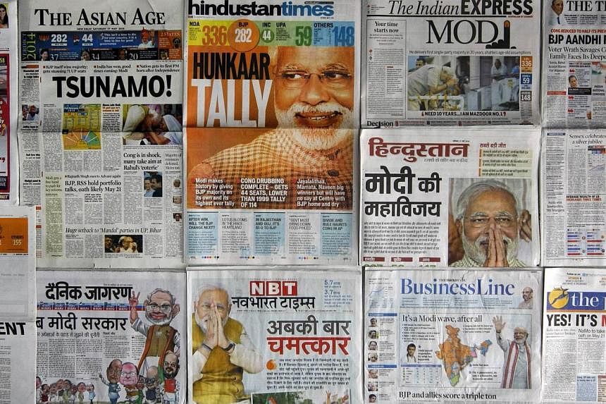 A selection of front pages of Indian newspapers with news of the election victory of Bharatiya Janata party (BJP) prime-ministerial candidate Narendra Modi in New Delhi on May 17, 2014.Indian newspapers on Saturday urged prime minister-elect Narendra