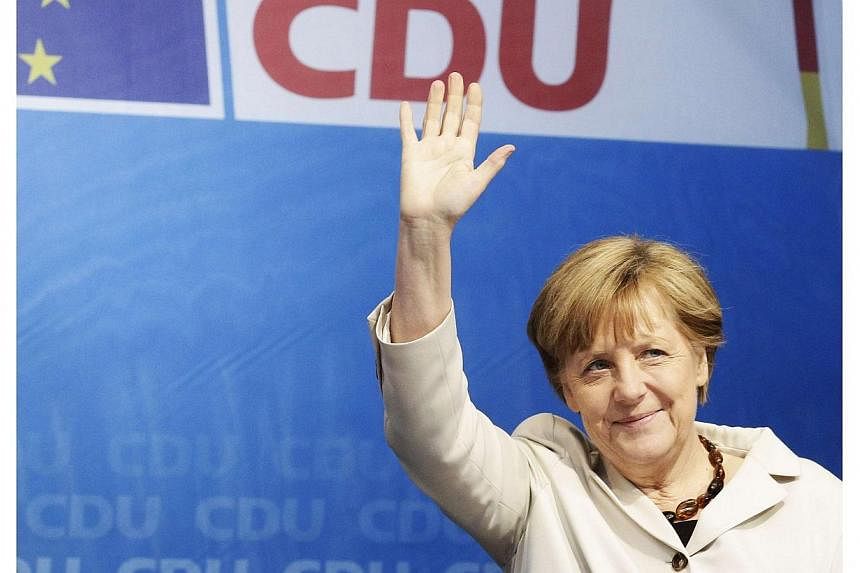 German Chancellor Angela Merkel waves as she arrives for an election rally in Berlin on May 14, 2014. -- FILE PHOTO: REUTERS