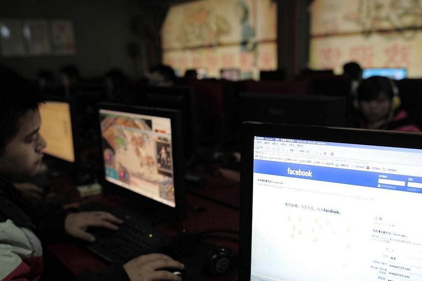 In a file picture taken on Feb 3, 2012, Chinese netizens use computers at an internet cafe in Wuhan, central China's Hubei province. China's Communist authorities ban their own people from accessing major global social media sites including Facebook,