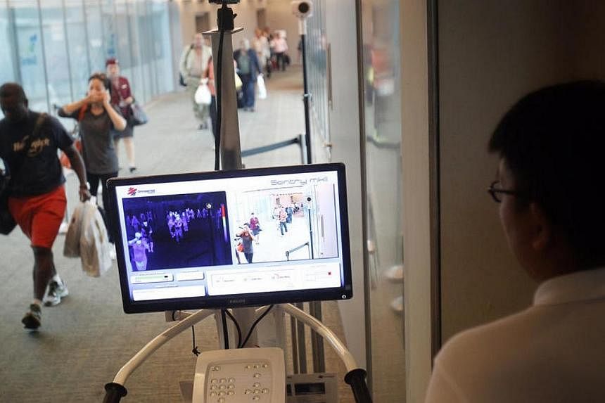 MERS screening for travellers arriving at Changi Airport Terminal 3 from Doha on May 18, 2014.&nbsp;Temperature screening for air travellers coming from Mers-affected Middle East countries, including the worst-hit country Saudi Arabia, started on Sun