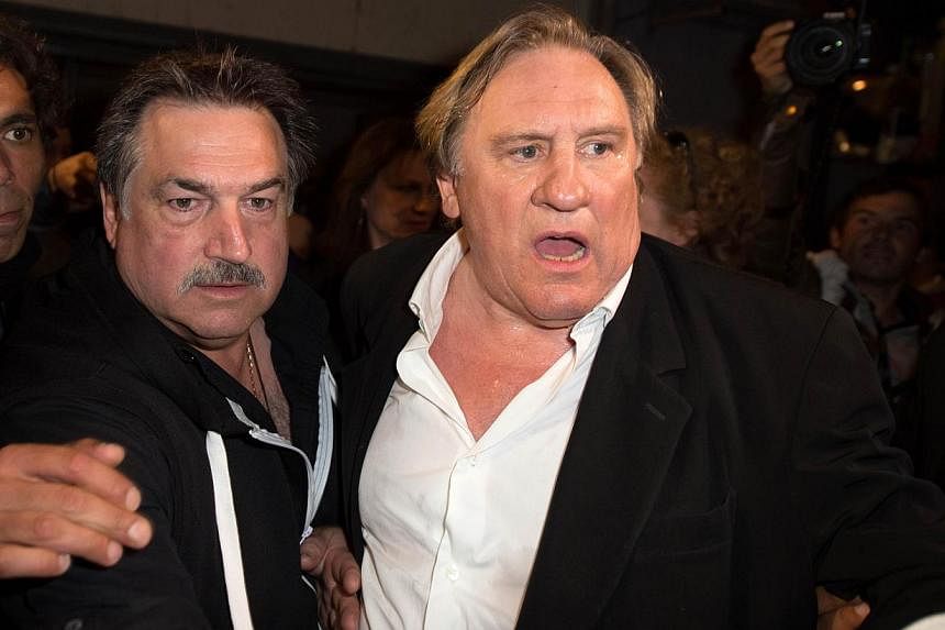 French actor Gerard Depardieu arrives to attend the screening of the film "Welcome to New York" on the sidelines of the 67th edition of the Cannes Film Festival in Cannes, southern France, on May 17, 2014. -- PHOTO: AFP